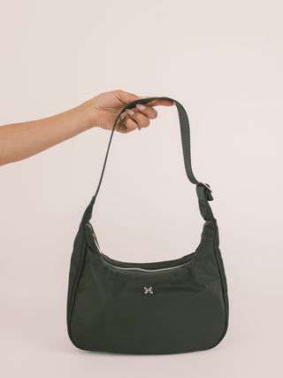 Emmy bag purse with person holding strap