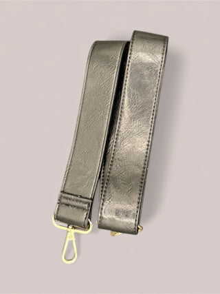 Pair of Black leather straps with gold hardware that match the black Mini Mae