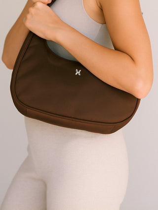 Dark brown emmy bag being worn over the shoulder - mom bag