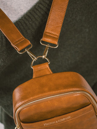 Zoomed up shot of a brown mini mae with both straps on 